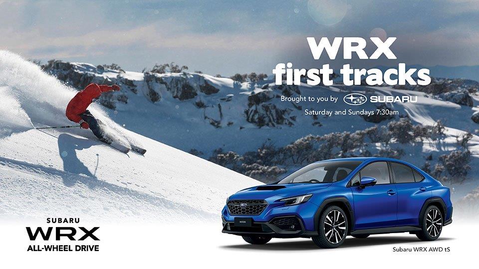 Skier skiing down mountain next to Subaru WRX Blue model  