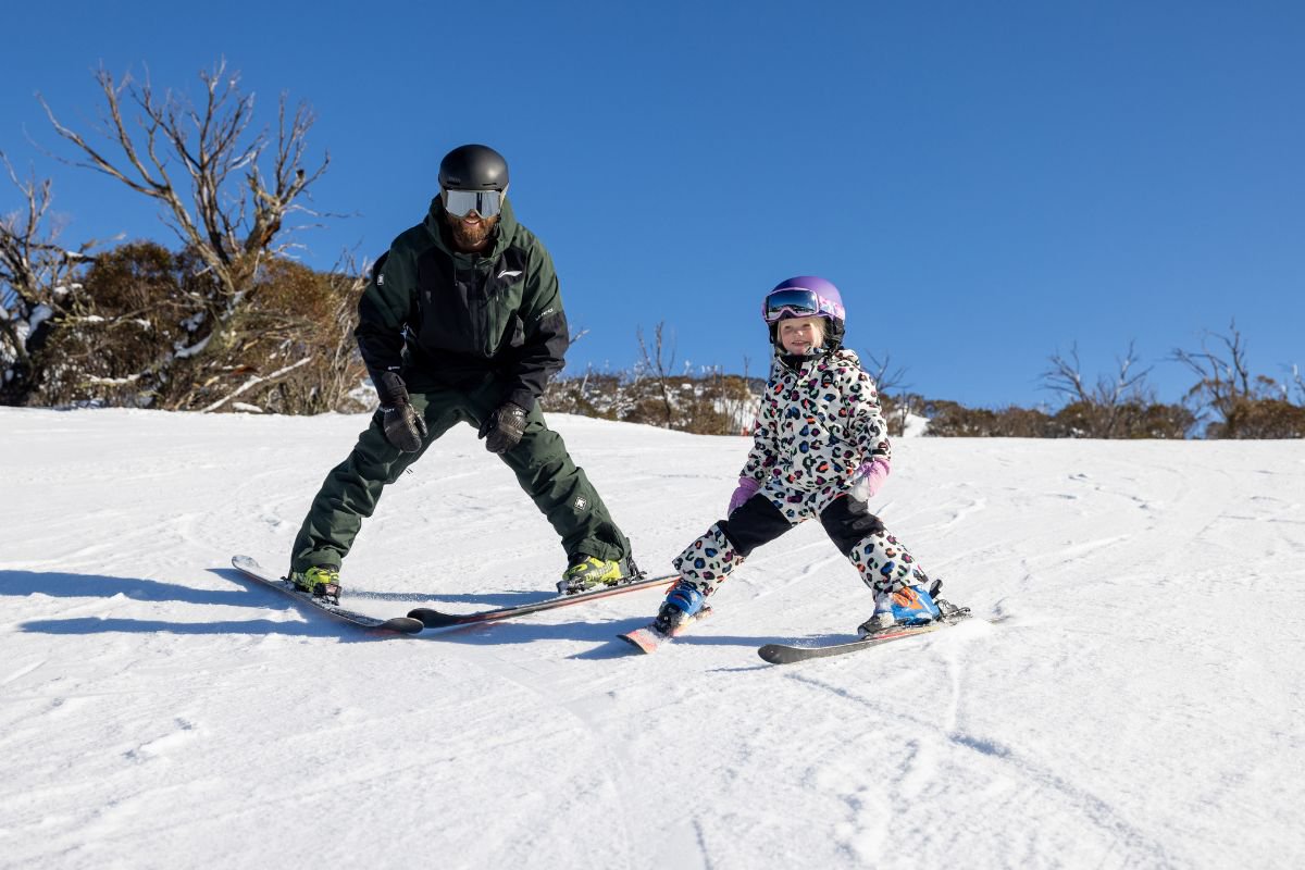 Dad and child skiing at Perisher