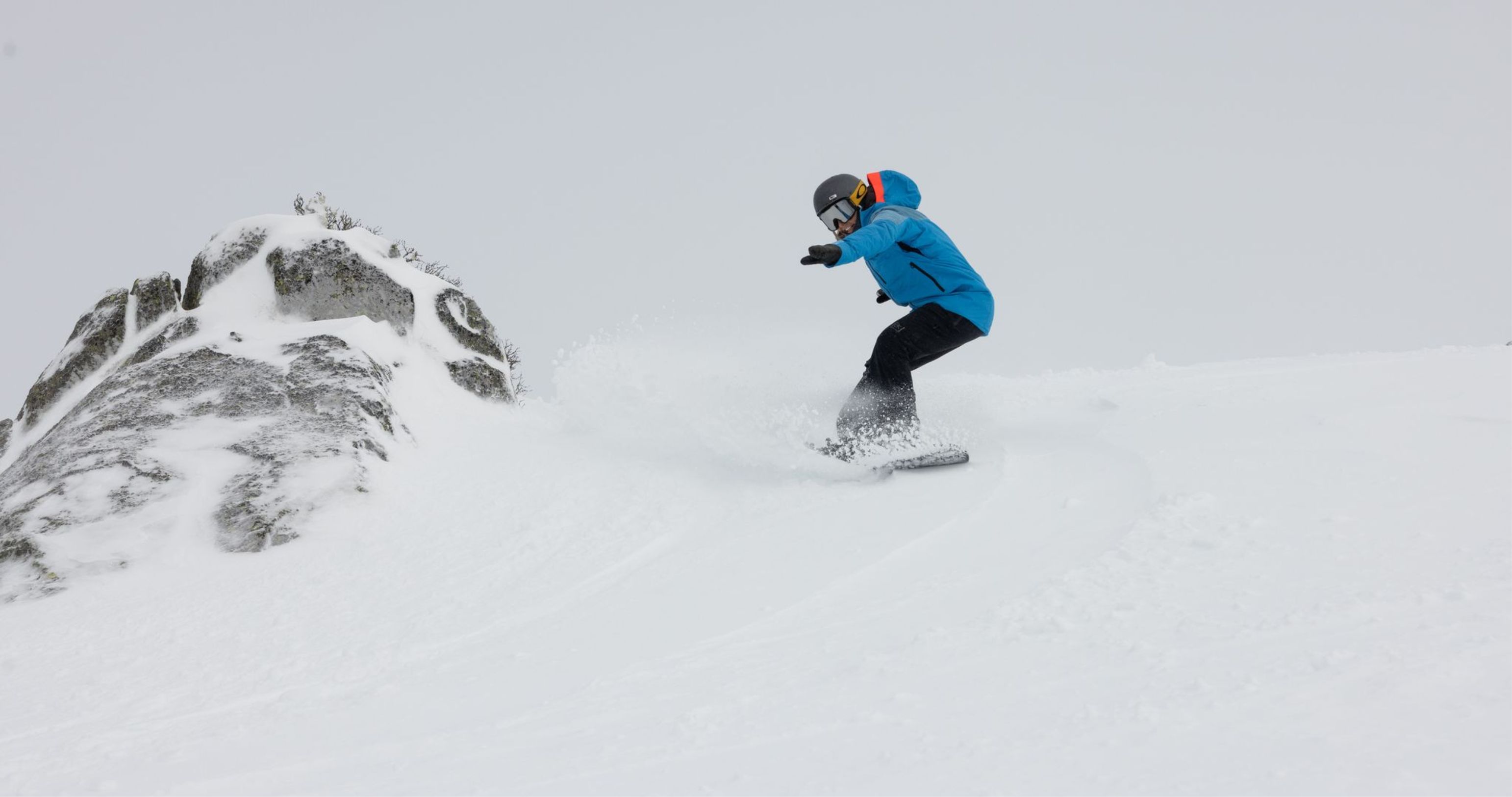 Snowboarder in pow 