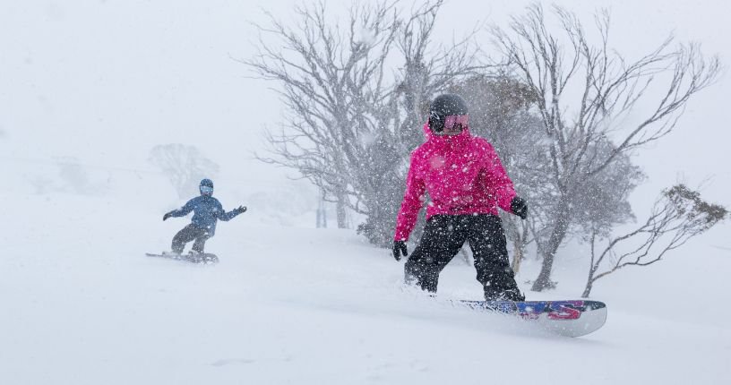 Snowboarders in powder at Perisher