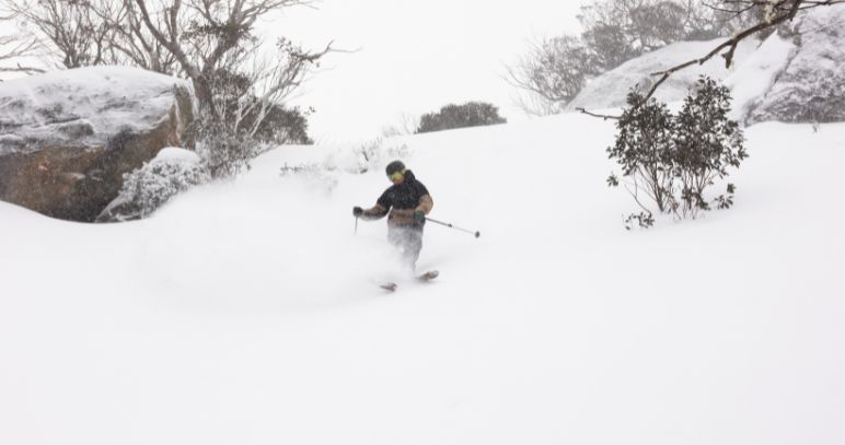Snowboarding through fresh snow at Perisher
