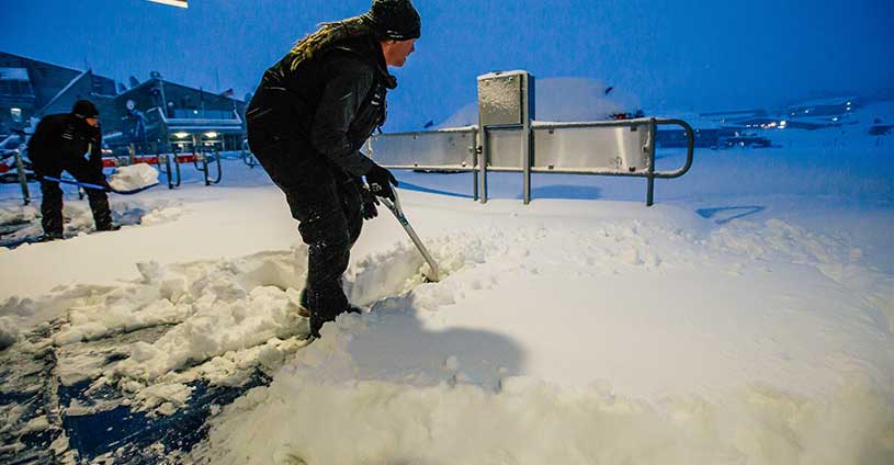 Perisher Staff Shoveling Fresh Snow