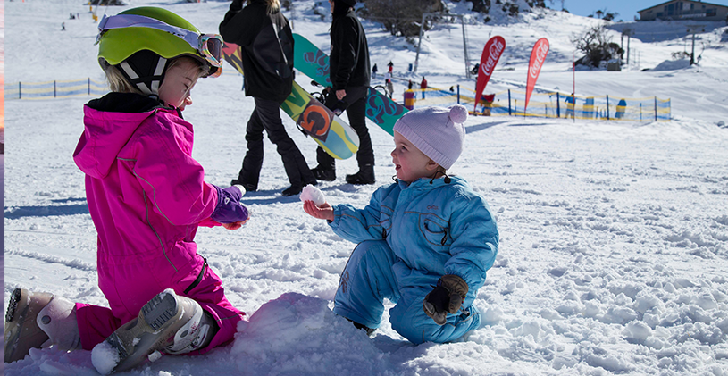 Little kids playing in snow